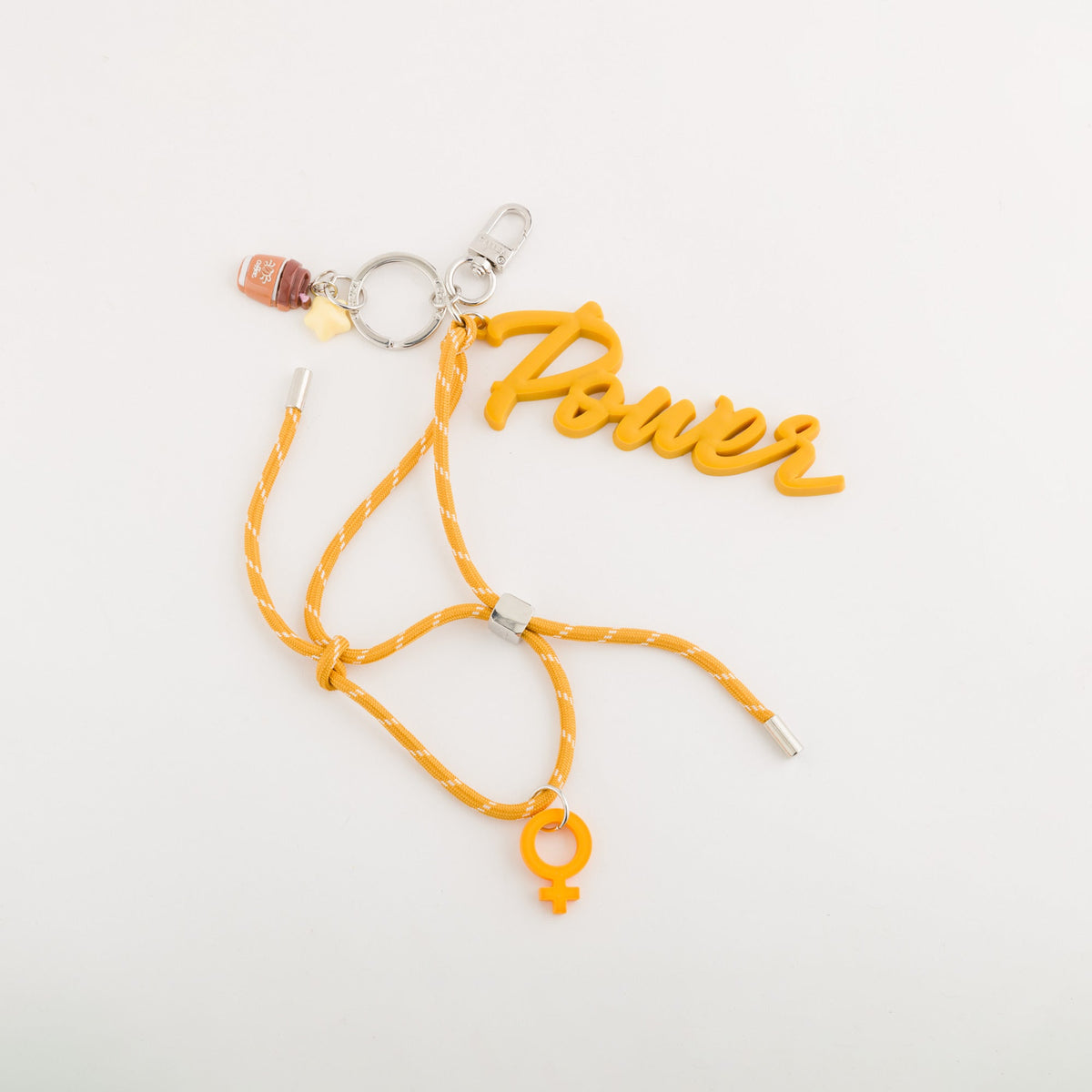 Carpisa Hrvatska â€“ Girl power keychain - Women's keychain â€“ Mustard â€“ AKD48101546 â€“ Image 1